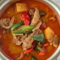 Red Curry Roasted Duck · Roasted duck, pineapples, tomatoes, bell peppers, and basil leaves in red curry. Includes ch...