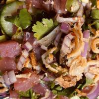Signature Larb Tuna · Sushi-Thai style, cilantro tomatoes, fried onions, grounded roasted rice and spicy lime dres...