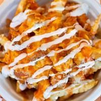 Chik'Nchz Cluckfries · Indulge! Our American-Grown & Certified Organic Crinkle Cut Fries topped with Chopped Golden...