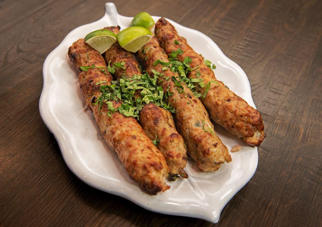 Lamb Seekh Kabab · Ground Lamb seasoned with spices, herbs, and barbecued in a clay oven.