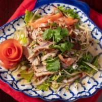Yum Roast Duck Salad · Medium spicy. Sliced roasted duck salad in chili lime juice dressing.