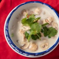 Tom Kha Gai Soup · Medium spicy. Chicken and mushroom in light coconut milk with galangal, chili, and fresh squ...
