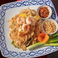 Pad Thai · Thin rice noodles stir-fried with a choice of  chicken,beef or shrimps egg, ground peanut, b...