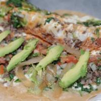 Quesadilla Suprema · 12-inch flour tortilla with choice of meat, melted cheesed, lettuce, tomato, cilantro, raw o...