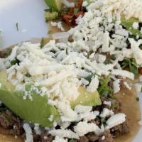 Street Mini Tacos (Each) · Includes onion, cilantro, avocado, and queso fresco.