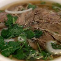 Brisket Pho (Phở Chín) · Traditional Vietnamese soup made with a rich beef broth, tender rice noodles, and choice of ...