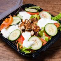 Royal Kabab Chicken Tikka Salad · Chunks of chicken and green salad.