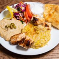 Chicken Shish Kabab · Ground chicken marinated in ginger, garlic, and house spices. Served with rice, bread, and s...