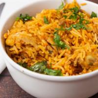 Chicken Biryani · Basmati rice and chicken cooked in our special spices.