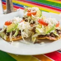 Tostadas · Three mini tostadas. Crispy tortilla topped with refried beans, lettuce, tomatoes, and fresh...