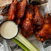 Wings · Gluten Free. Eight crispy wings tossed in your choice of buffalo, chipotle BBQ, makers mark ...