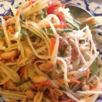 Papaya Salad / Som Tum · This salad captures the essential flavor of Thailand. Fine shredded green papaya, tossed wit...