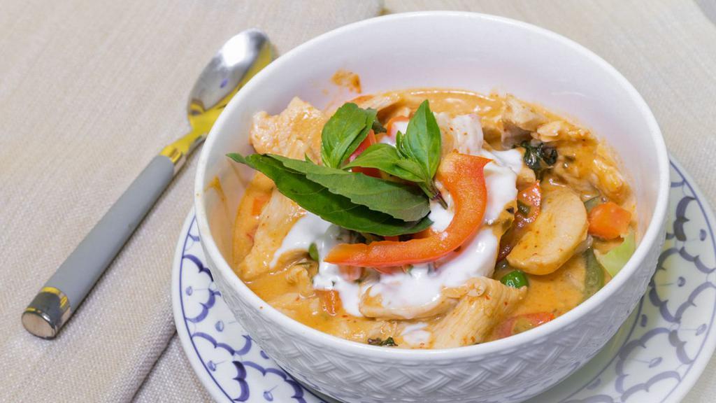 Panang Curry · Simmered​ in rich red panang curry paste in coconut milk with bell peppers, zucchini, basil leaves.