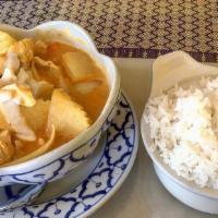 Famous Yellow Curry · Simmered in mild yellow curry paste in coconut milk with potatoes and onions.