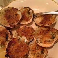 Clams Oreganata · Baked clams in a garlic lemon sauce.