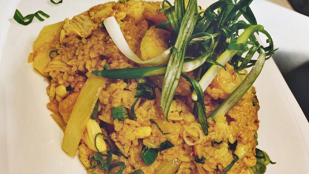 Pineapple Fried Rice · Fried rice with shrimp, chicken, pineapple chunks, cashew nuts, yellow onion, and curry powder.