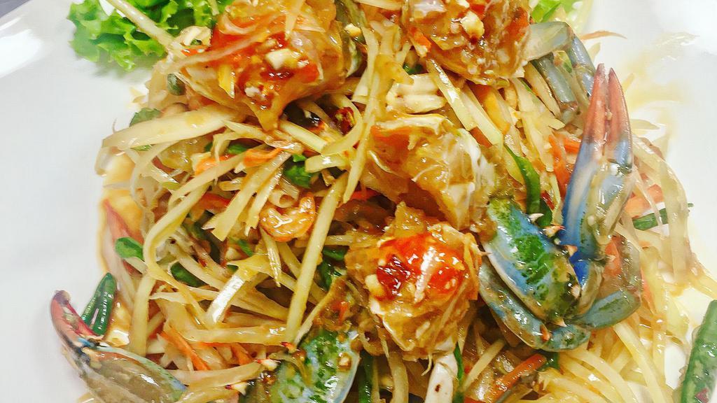 Som Tum (Green Papaya Salad) · Thai traditional salad with the mixture of shredded green papaya, carrot, green beans, tomatoes, chili, peanuts, and shrimps in spicy lime dressing.