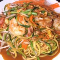 Zucchini Noodle Pad Thai · Spiralized zucchini and carrot noodles tossed in tamarind sauce with eggs, peanuts, and bean...