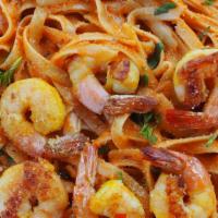 Prawn - Roast Tomato Fettuccine · Cooked in creamy sauce and herbs.