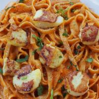 Scallop - Roast Tomato Fettuccine · Cooked in creamy sauce and herbs.