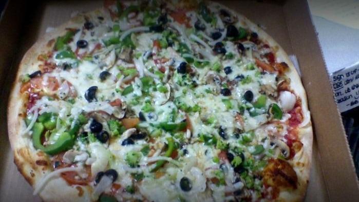 Greek Pizza · Feta cheese, olives & tomato