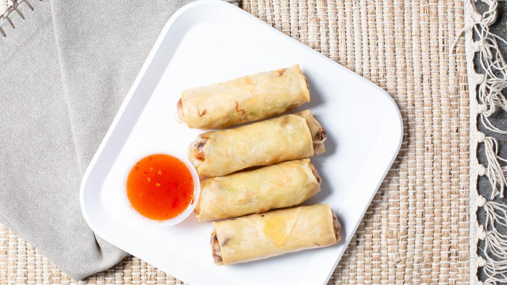 Crispy Spring Rolls · Golden fried egg rolls with crystal noodles, carrot, cabbage and celery served with sweet chili sauce.