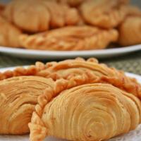 Curry Puffs · Deep fried pastry shell pie consisting of homemade curry blended with potatoes, carrots and ...