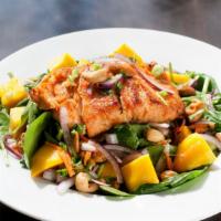 Mango Salsa Salmon · Pan seared salmon topped with a very fresh and richly flavored of Thai mango salsa, cashew n...
