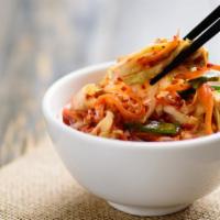 Kimchi Slaw · A tangy mix of pickled cabbage.