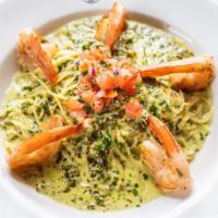 Shrimp Pesto Alfredo · Large grilled shrimp served on a bed of angel hair pasta with creamy, nut free, pesto alfred...
