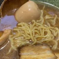 Tonkotsu Shoyu · Chashu pork, Kikurage, bamboo shoots, mustard, leaves, soy sauce egg, scallion, sesame seeds...