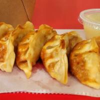 Gyoza (Dumplings) · 5 pieces of deep-fried chicken dumplings, topped with Yamyam sauce, teriyaki sauce, jalapeno...