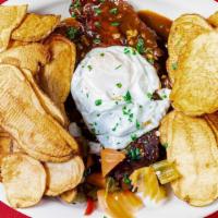 Mini Sirloin Topped With Fried Egg In Teimoso Sauce (Bitoque A Portuguesa) · Served with Spanish chips.