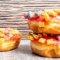Cereal Donut - Cap N Crunch/Pink Frosting · Raised donut - Pink frosting with Cap n Crunch