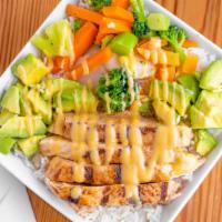 Chicken Rice Bowl · White rice with grilled chicken, avocado, and steamed vegetables.