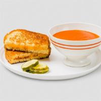 Grilled Cheese And Tomato Soup · Melted american cheese served with house tomato soup- upgrade to a deluxe and add chopped br...