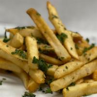 Garlic Fries · Classic french fries tossed in our signature fresh garlic confit and seasoning.