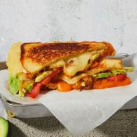 The Fancy · Melted Cheddar and Swiss with caramelized onions, tomato, avocado and mayonnaise grilled bet...