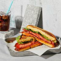 The Blt · Melted Cheddar cheese with bacon, lettuce, tomato and mayonnaise grilled between two slices ...