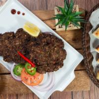 Peshawari Beef Chapli Kabob · 2 pieces. Minced beef seasoned with green chilies, dried pomegranate, coriander seeds and fr...