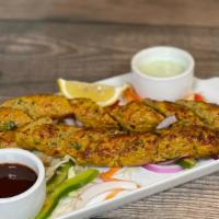 Chicken Seekh Kabob · Skewered minced chicken mixed with ginger, garlic, green chilies, spices and cumin seeds.