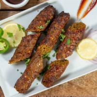 Beef Seekh Kabob · Skewered minced beef mixed with ginger, garlic, green chilies, spices and cumin seeds.