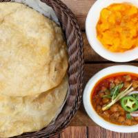 Halwa Puri · Traditional Pakistani breakfast, includes a delicious combo of halwa, channa and 2 hot puris.