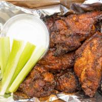 Buffalo Wings · 8 Jumbo Chicken Wings, brined and marinated, smoked and fried. Topped with Buffalo Wing Sauc...