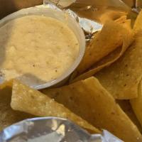 Side Of Queso Dip · 5oz of Queso Dip and Freshly Fried Tortilla Chips.