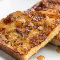 French Toast · Slices of French toast with butter and syrup