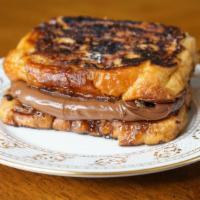 Nutella French Toast Sandwich · Yummy Nutella on French Toast Sandwich so you can eat it with one hand. With Butter and syrup.