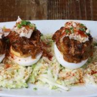 Deviled Eggs · Traditional deviled egg, smoked pulled pork, chicharrónes, creamy coleslaw, hot sauce reduct...