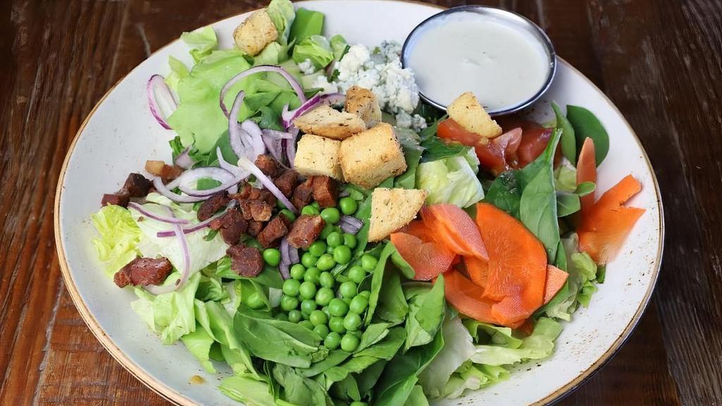 Salad - Chopped · Boston lettuce, spinach, applewood-smoked bacon, boiled egg, tomato, red onion, English cucumber, carrot, peas, blue cheese crumbles, brioche-herb croutons, choice of dressing [Gluten-free upon request]