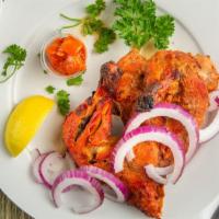 Tandoori Chicken · Requires 15 to 20 minutes. Half spring chicken marinated in yogurt and spices skewered in cl...